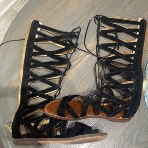 Tall black gladiator sandals